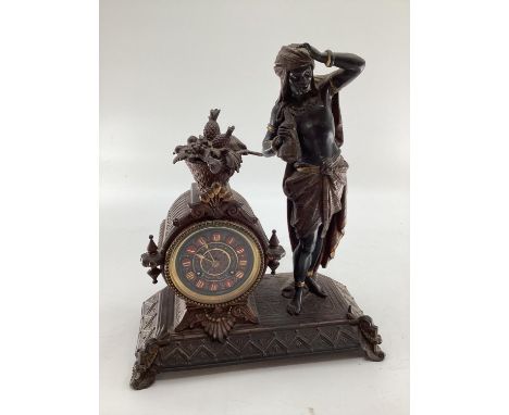 A late C19th cast spelter figural mantle clock, cast figure of an Arab gentleman in the manner of of Bergman, circular black 