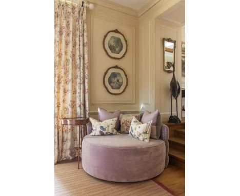 Large circular purple/mauve velvet, buttoned backed and brass studded chair , with 3 small matching cushions. widest point ap
