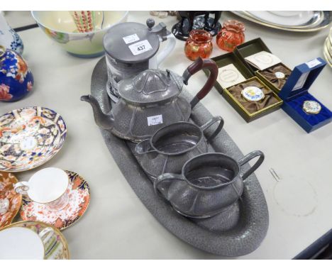 AN EARLY TWENTIETH CENTURY THREE PIECE HAMMERED PEWTER TEA SERVICE, AND A 'KAISER' PORCELAIN BEER STEIN WITH PEWTER LID (5) 