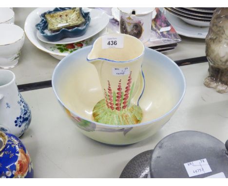 AN A.J. WILKINSON LTD. CLARICE CLIFFEE 'HONEY GLAZE' BOWL AND A 1930's CLARICE CLIFF STYLE JUG (2) 