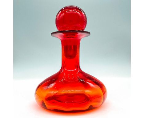 A blown glass amberina decanter which shades in color from amber to ruby red at the top. Dimensions: 5"W x 7.5"HManufacturer: