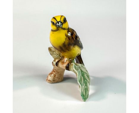 Bird perched on branch with large green leaves. Goebel W. Germany backstamp. Marked CV63 on base with date. Issued: 1962Dimen