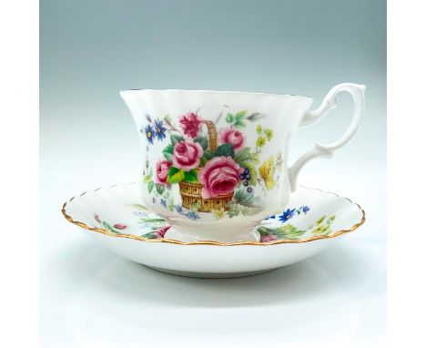 This is a set consisting of a white teacup and tea plate decorated with floral patterns primarily magenta roses. Royal Albert