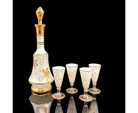White enamel on glass decanter and four cordial glasses with red dot, gold speckled and floral decoration. The decanter with 