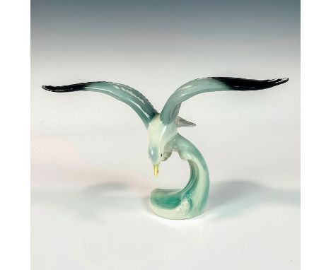 Bird in flight has gloss finish. Goebel W. Germany backstamp. Imprint on base CV76. Issued: 1968Dimensions: 8.5"L x 3.75"W x 