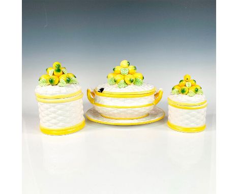 Handcrafted porcelain lidded canisters with lemons sitting on the lid in high gloss finish. The basket-weave canister bodies 