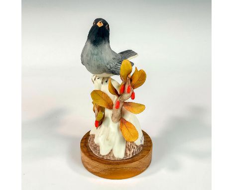 Porcelain in matte finish on snowy branch with leaves and red flowers. M.E. Moussalli signature and '203' on porcelain base. 
