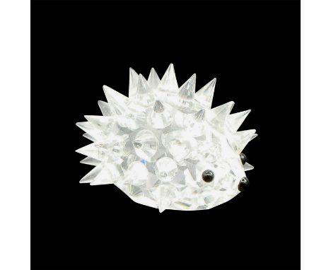 Clear, spiney body with black button eyes and nose. Swarovski backstamp. 7669 035 000. This item has its original box: 3.25"L