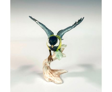 Bird perched on branch has yellow body with gray wings and tail. Goebel W. Germany backstamp. Issued: 1966Dimensions: 5"L x 4