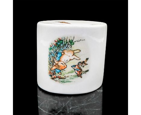 Porcelain coin bank with an illustration and an excerpt from the book â€œThe Tale of Peter Rabbit.Wedgwood and Fredrick Warne