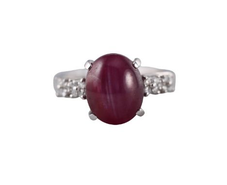  Metal  : 18k Gold   Designer  :  Not Signed   Gemstone  : Diamonds 0.18ctw, Star ruby - 8.11ct.    Measurements  : Ring size