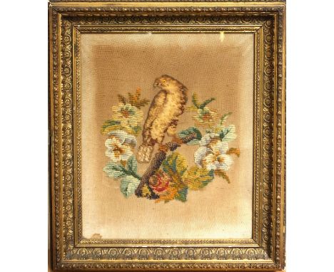 A Victorian needlework panel of a parrot perched upon a branch, worked in colours within a rosewood swept frame, image 56 cm 