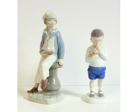 Bing &amp; Grondahl figure Peter with apples, model number B1696, H. 18cm, by Ingeborg Plockross-Irminger and a Lladro figure