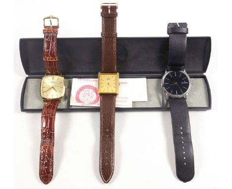 Seiko gilt metal wristwatch with a rectangular gilt dial and baton markers enclosing a quartz movement, on a brown leather st
