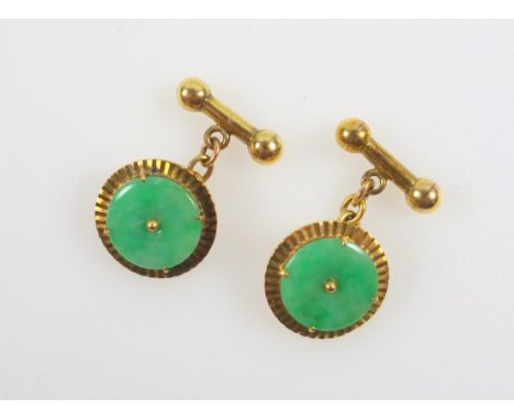 Pair of Chinese yellow metal and jade roundel and dumbell cufflinks, stamped 18K, D 1.8cm, gross 9.2grs, in a pouch (3) 