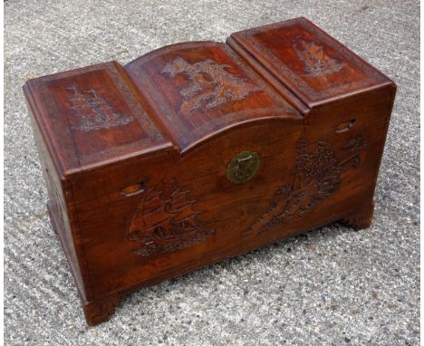 A Chinese camphor wood lined chest with carved naval and architectural scenes. 62cm x 104cm x 52cm