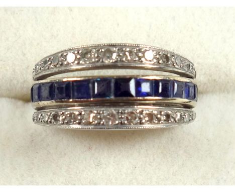 Articulated white metal ring, size L 1/2, set with diamonds, synthetic rubies and sapphires, gross 4.6grs