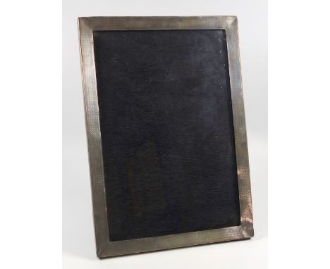 George V silver mounted engine turned rectangular photograph frame by S &amp; M, Birmingham 1925, 31 x 22cm (a/f) 
