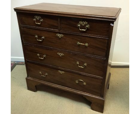 A 19th Century mahogany chest, the top with applied moulded edge above two short and three long graduated drawers with brass 