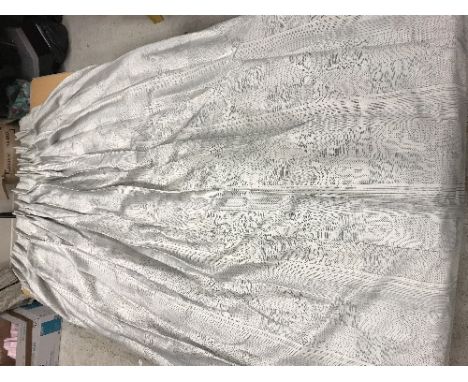 A pair of silk type blue and cream with quilt stitch style pattern interlined curtains with taped double pencil pleat heading