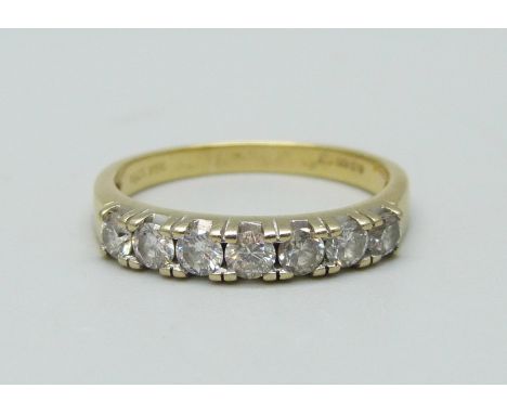 An 18ct gold, seven stone diamond ring, approximate 0.60ct diamond weight, 3.8g, Q 