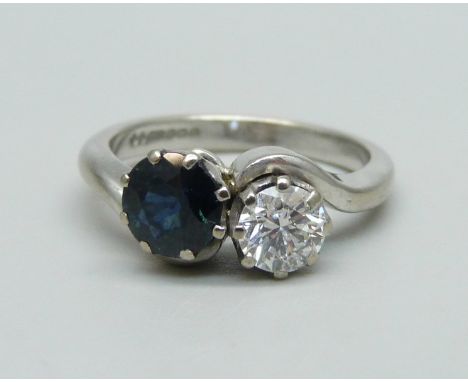 An 18ct white gold, diamond and sapphire ring, approximately 0.5ct diamond and 1ct sapphire, 5.2g, M 