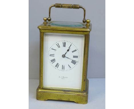 A heavy brass carriage clock, A.J. Wright, Paris, Maltese Cross winding protection, strikes on gong, with key, height 13.5cm 