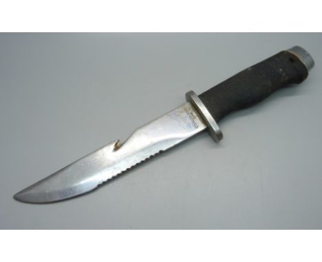 A hunting knife, marked 'stainless steel, Japan', no scabbard 