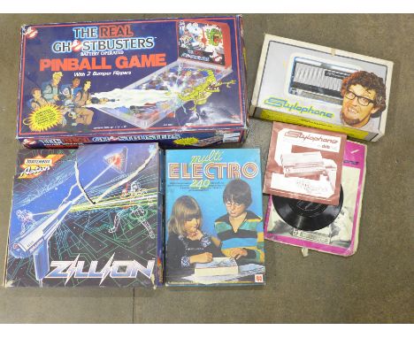 A Ghostbuster battery operated Pinball Game, a Matchbox Action Zillion white light beam game, Rolf Harris stylophone and a Mu