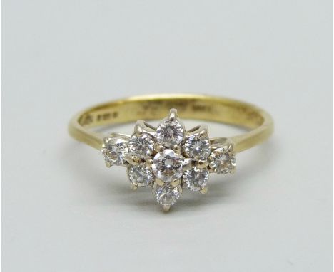 An 18ct gold, nine stone diamond cluster ring, shank marked 0.35ct, 2.5g, L 