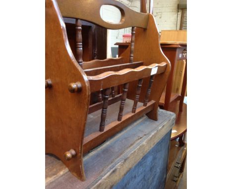 A TRIPOD TABLE AND A MAGAZINE RACK