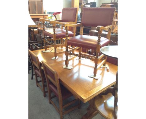 A LIGHT OAK DRAWER LEAF REFECTORY TABLE WITH 6 RED LEATHER STUDDED OAK CHAIRS