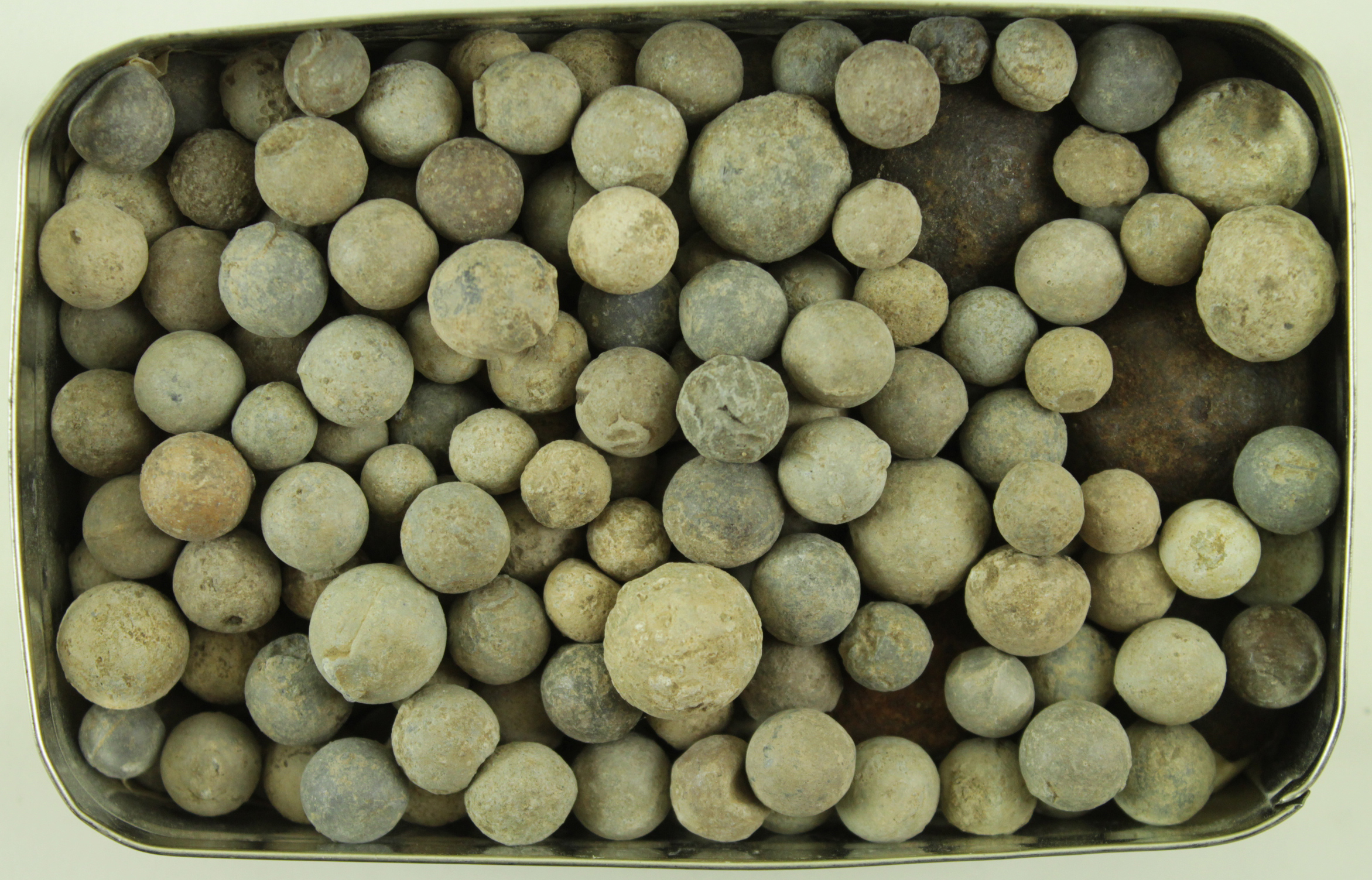 Tin of 18th century small cannon balls & musket balls (Buyer collects)