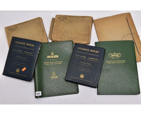 A ROLEX SPARE PARTS CATALOGUE AND A ROLEX SPARE PARTS CATALOGUE TUDOR VOL II AND TWO OTHERS, one still in it's oroginal card 