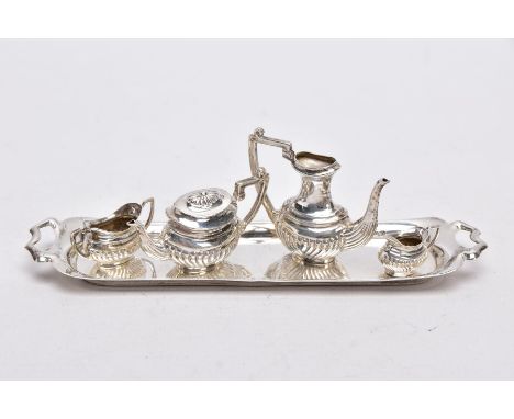 A MINIATURE FIVE PIECE SILVER TEA SET, comprising of teapot with cover, coffee pot missing cover, a double handled sugar bowl