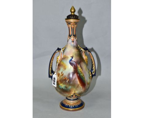 A ROYAL WORCESTER 'HADLEY WARE' TWIN HANDLED VASE AND COVER, the vase painted with a peacock on a branch amongst rose hips, s