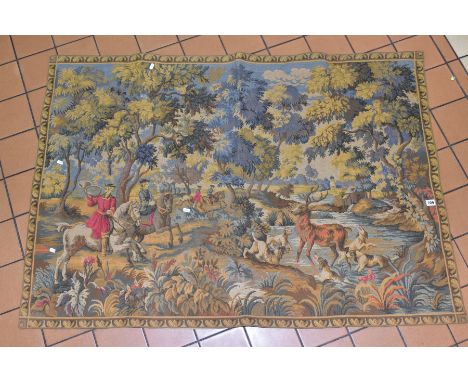 A 20TH CENTURY MACHINE MADE WALL HANGING TAPESTRY depicting a hunting scene, approximate size 104cm x 151cm, pole not present