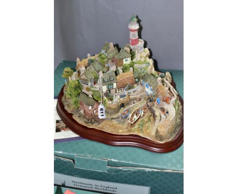 A BOXED LIMITED EDITION LILLIPUT LANE SCULPTURE, 'Out of the Storm' L2064, No 0662/3000, on a wooden plinth, with certificate