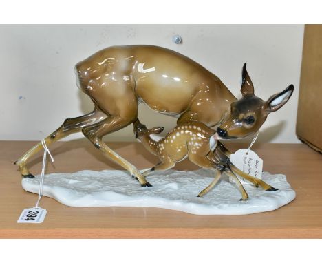 A 20TH CENTURY ROSENTHAL PORCELAIN FIGURE GROUP OF A DOE AND FAWN, modelled as standing on a white glazed base, printed facto
