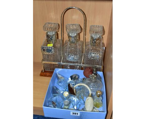 A SMALL QUANTITY OF MOSTLY MODERN PERFUME BOTTLES AND ATOMISERS, together with a modern decanter stand containing three press
