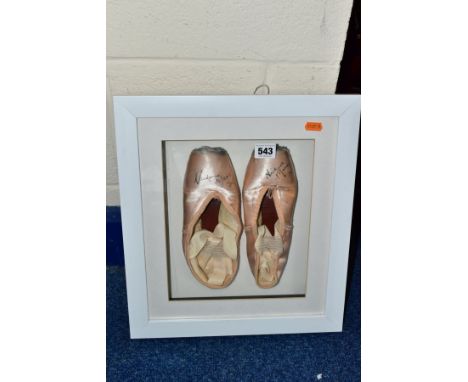 A PAIR OF FRAMED AND GLAZED PINK SATIN POINTE BALLET SHOES AUTOGRAPHED BY VICTORIA MARR former First Sololist with Birmingham