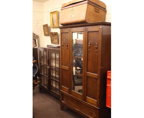 Early 20th Century oak mirror door wardrobe, mahogany glazed panel two door bookcase and tin trunk (3)