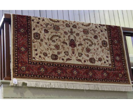 Keshan carpet with a beige ground 2.30 by 1.60