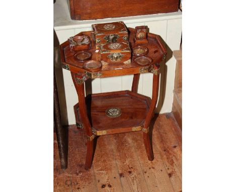 Eastern mahogany and brass inlaid occasional table, two jewel boxes, ashtray, matchbox holder and four coasters