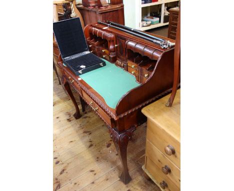 Mahogany Chippendale style two drawer writing table on ball and claw leg having leather writing surface and a series of drawe