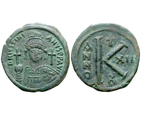 Justinian I Æ Half Nummus. Constantinople, Dated RY 12 = AD 538-539. D N IVSTINIANVS P P AVG, helmeted and cuirassed bust fac