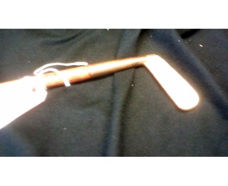 Golf Clubs-A brass headed putter formed as a hickory shafted walking stick