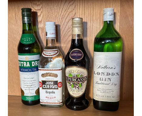 Four bottles of spirits, a Vermouth, Jose Cuevve Tequila, Super Casis and a Hollorns dry Gin 