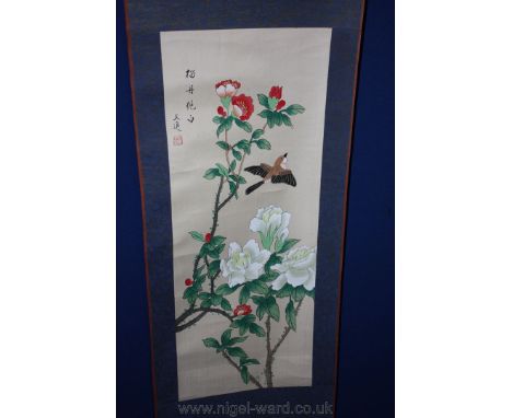 A Chinese watercolour Scroll of a flying bird and blossom.