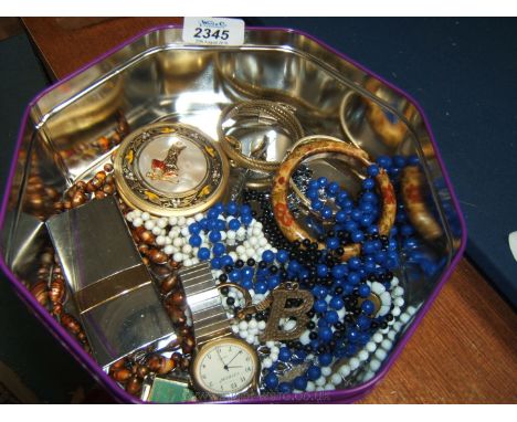 A quantity of costume jewellery, beads, compact, perfume atomiser etc